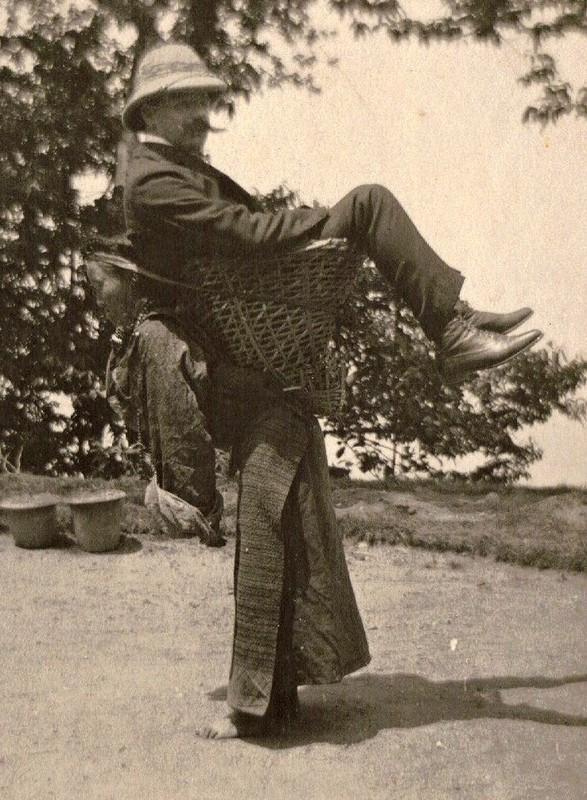 a-british-merchant-being-carried-by-a-sikkimese-lady-on-her-back-west-bengal-circa-1903