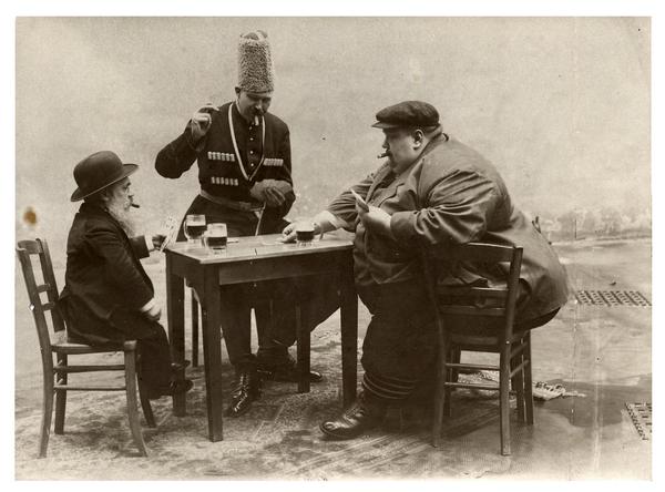 a-french-postcard-with-the-tallest-shortest-and-fattest-men-of-europe-playing-a-game-of-cards-1913.jpg