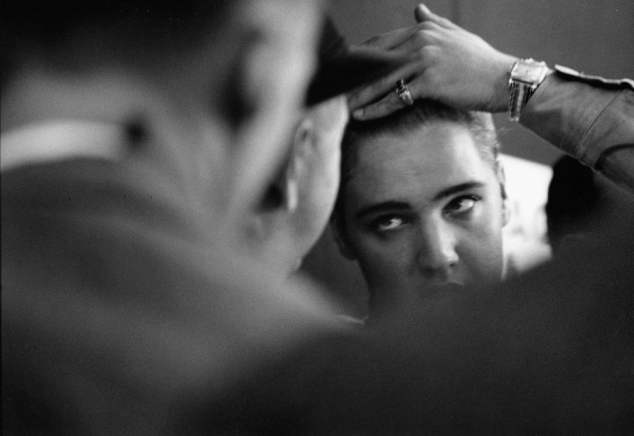 Private Elvis Presley combing his hair, 1958 Photograph: Courtesy of Monroe Gallery